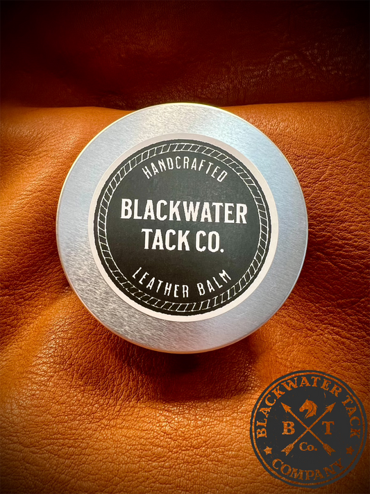 a closed tin of leather balm