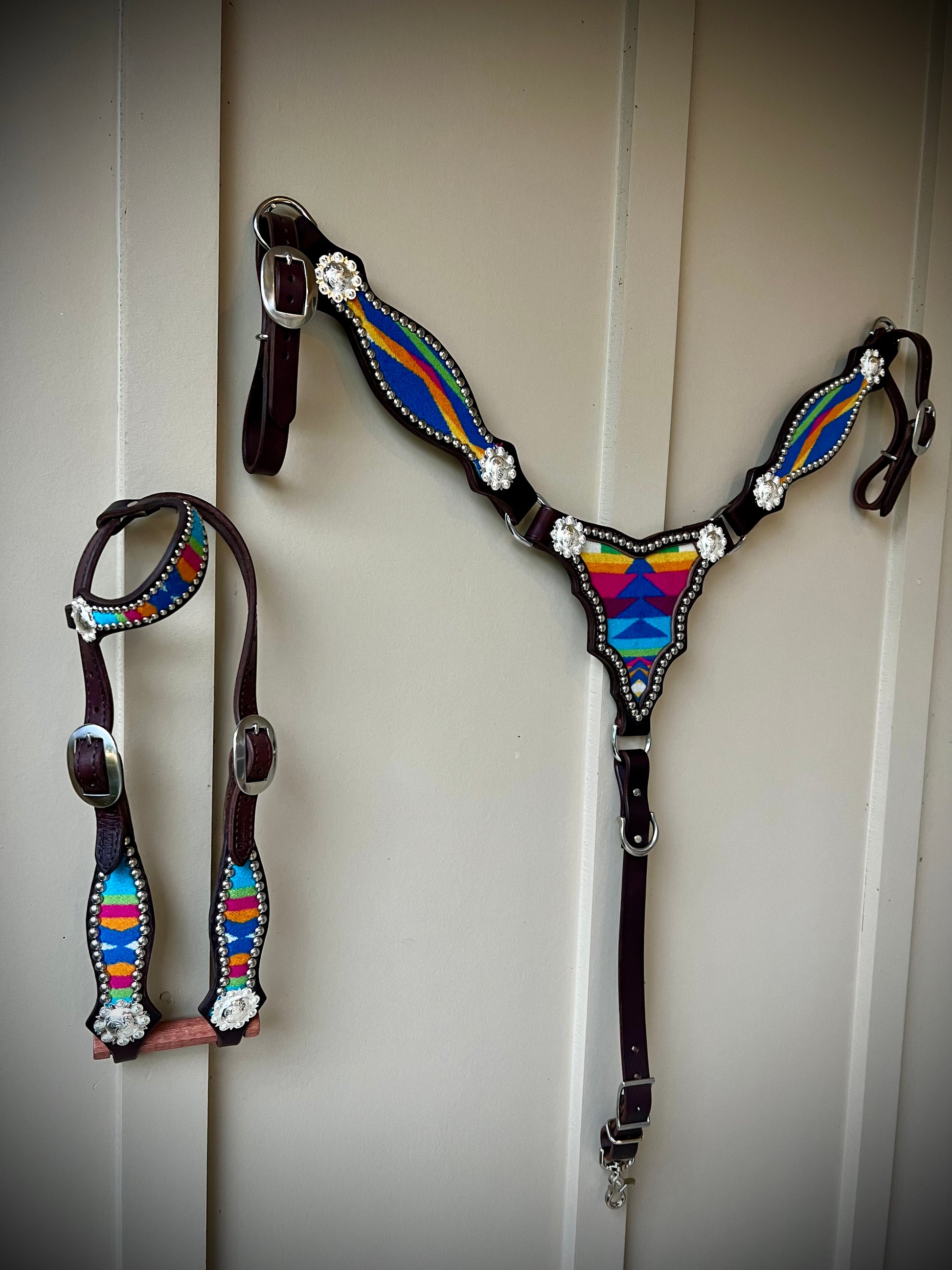 a breast collar and headstall with wool inlay, bright silver spots, and bright silver scalloped berry style conchos