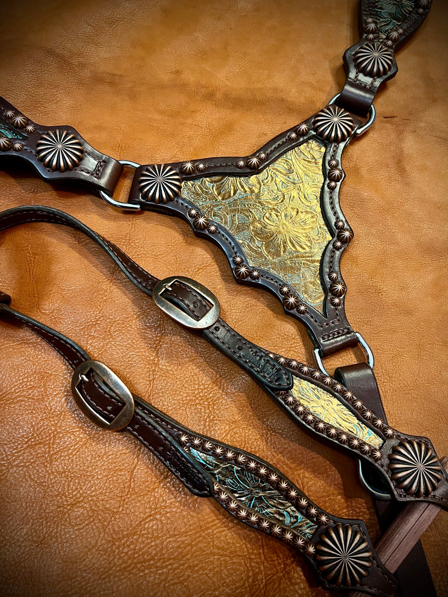 a bronze and turquoise gladiator style breast collar and one-ear headstall