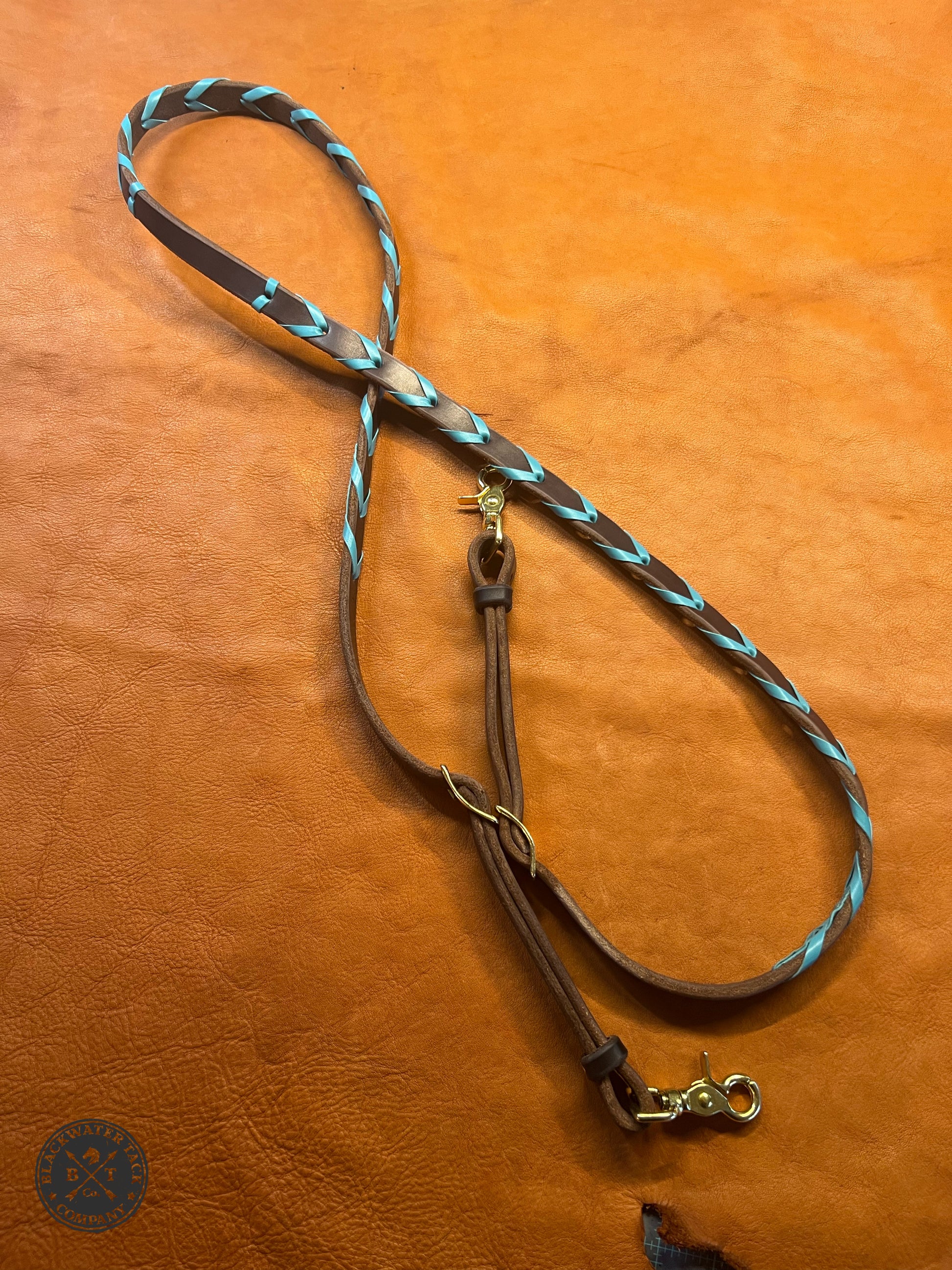 turquoise laced reins showing pattern and hardware