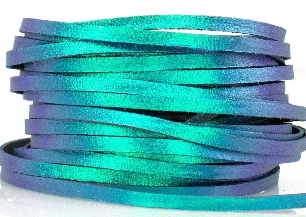 a spool of purple and teal metallic lace